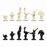 Gucci black and ivory animal chess-piece designs, detail — AI-edited manufacturer reference image; sample designs, not a full-set count.
