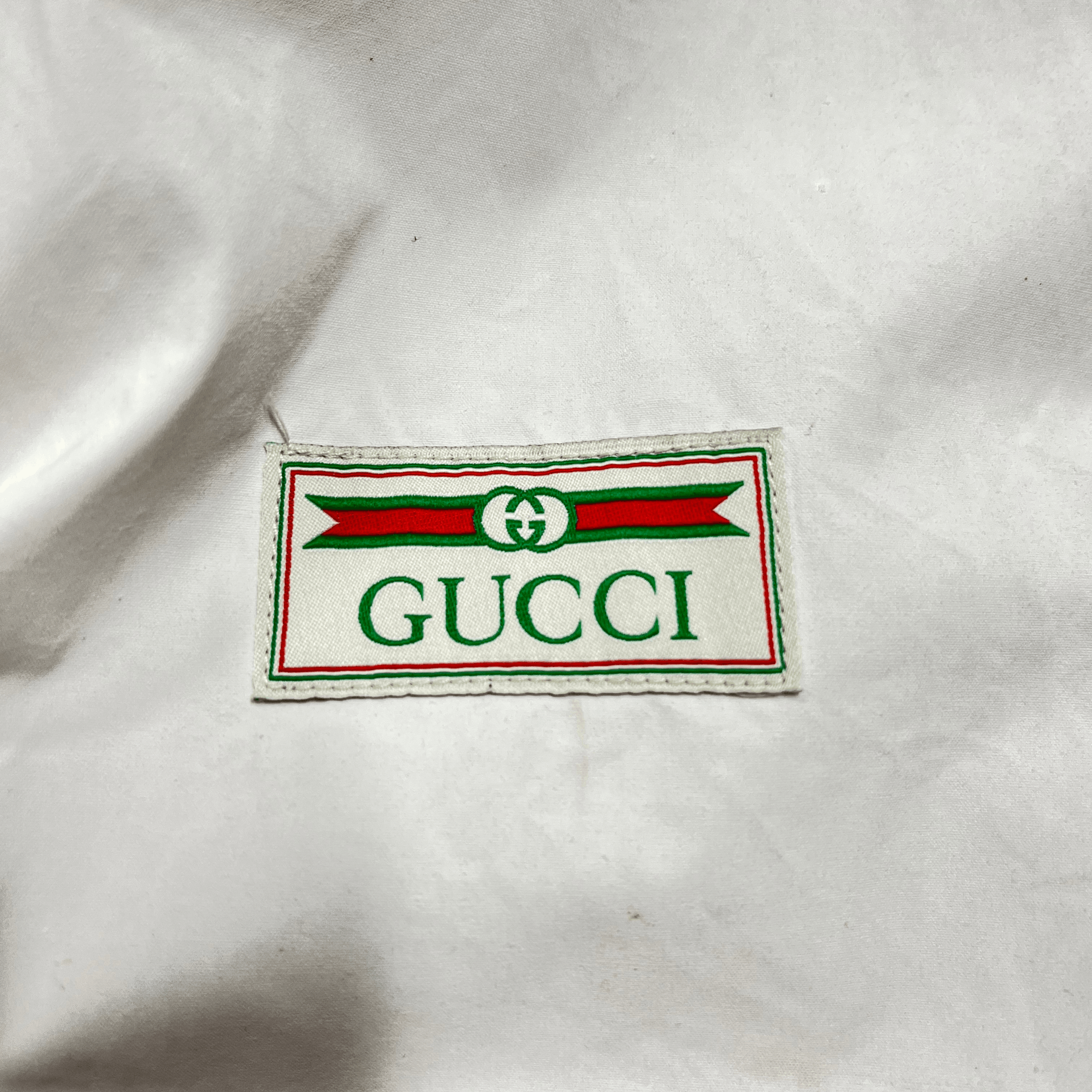 Gucci logo jacket sales